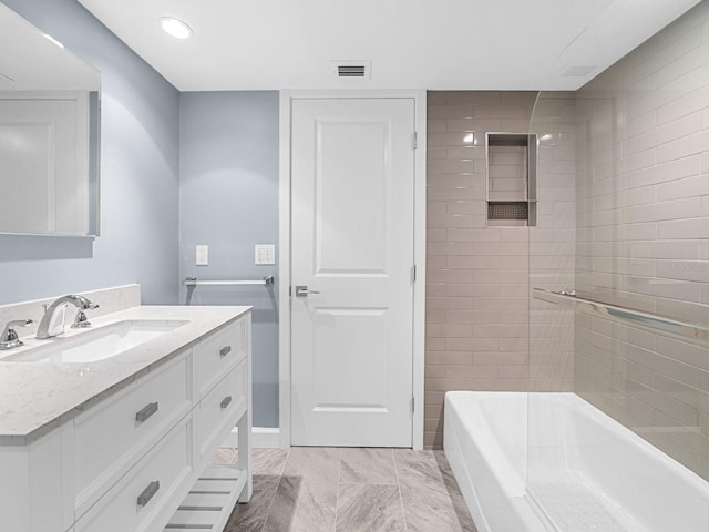 full bathroom featuring visible vents, vanity, a bath, and recessed lighting