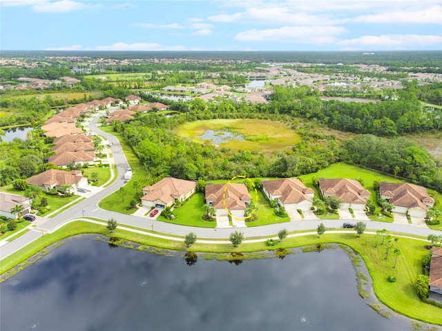 bird's eye view with a water view