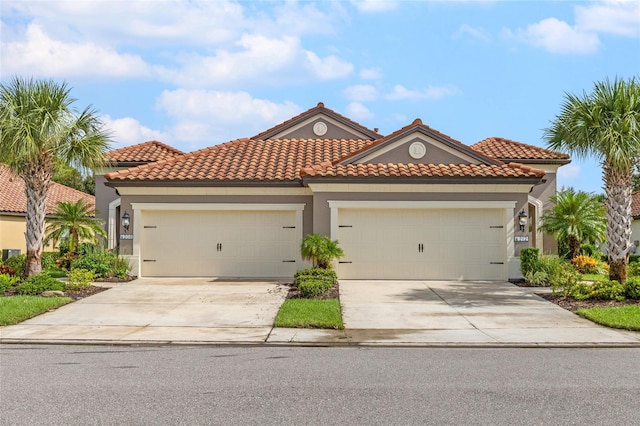 mediterranean / spanish house with a garage