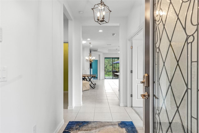 corridor with light tile patterned floors