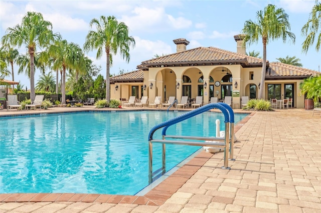 view of swimming pool featuring a patio area