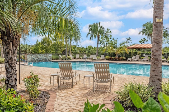 view of pool featuring a patio and pool water feature