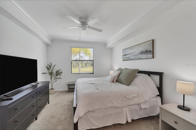 carpeted bedroom with crown molding and ceiling fan