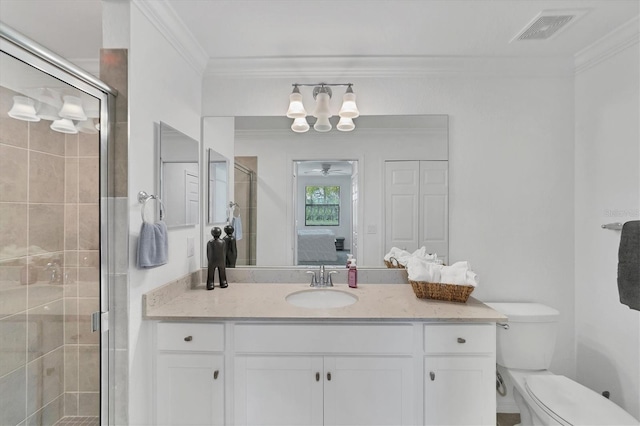 bathroom featuring vanity, toilet, ornamental molding, and an enclosed shower