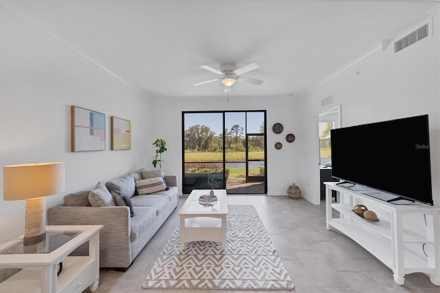 living room with crown molding and ceiling fan