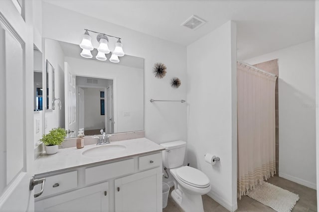 bathroom featuring vanity, toilet, and a shower with curtain