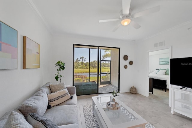 living room with crown molding, light tile patterned flooring, and ceiling fan