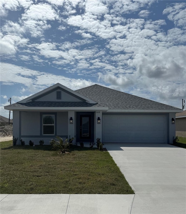 single story home featuring a garage and a front yard