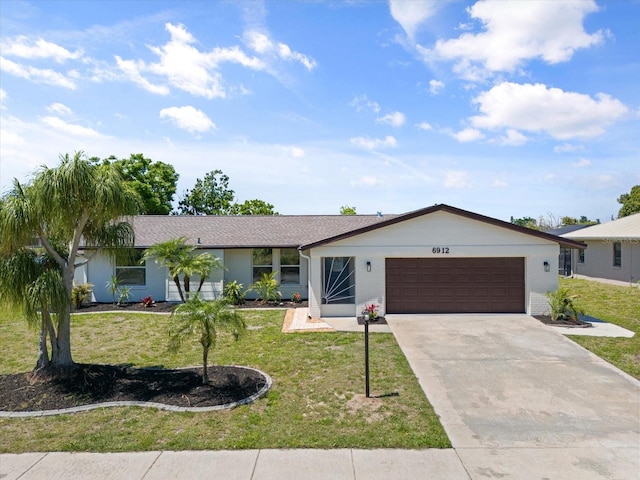 ranch-style house with a front lawn and a garage