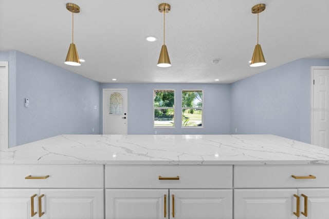 6912 Kenwood Dr, North Port, FL 34287 - kitchen featuring white cabinets, pendant lighting, light stone counters, and recessed lighting