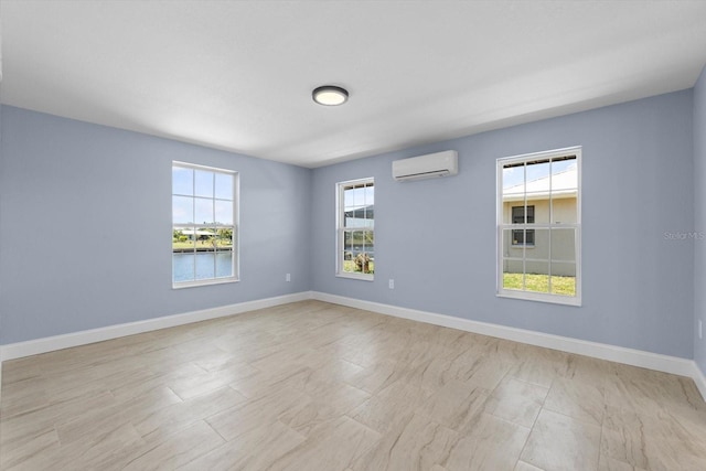 6912 Kenwood Dr, North Port, FL 34287 - empty room featuring a wall unit AC and baseboards