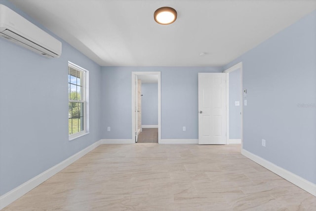 6912 Kenwood Dr, North Port, FL 34287 - empty room with an AC wall unit and baseboards