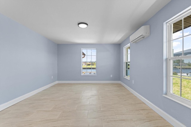 6912 Kenwood Dr, North Port, FL 34287 - empty room with a wall unit AC, baseboards, and a water view