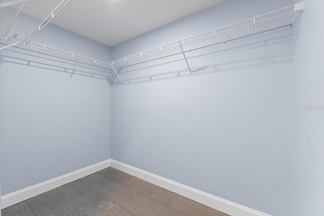 6912 Kenwood Dr, North Port, FL 34287 - walk in closet featuring dark wood-style flooring