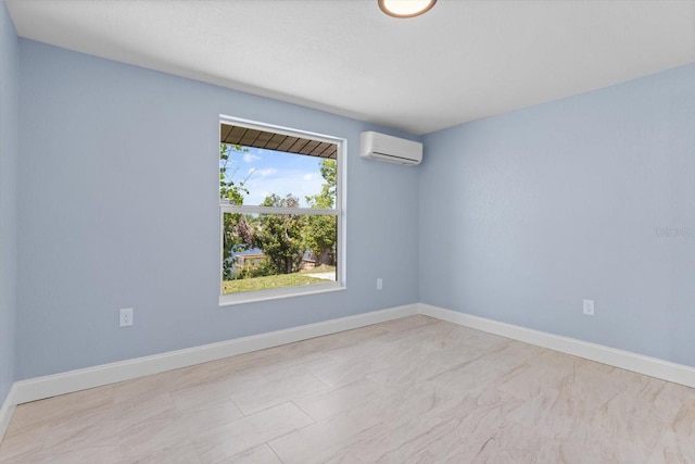 empty room featuring baseboards and an AC wall unit