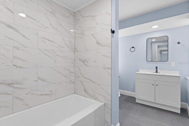 6912 Kenwood Dr, North Port, FL 34287 - bathroom with vanity, baseboards, shower / tub combination, and recessed lighting