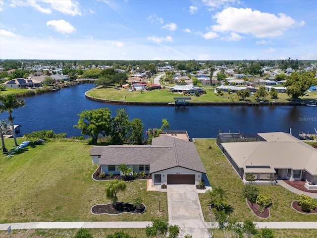 birds eye view of property featuring a water view and a residential view