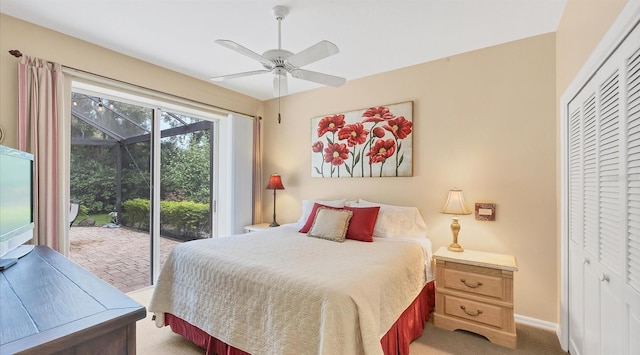 bedroom with a closet, access to exterior, carpet flooring, and ceiling fan