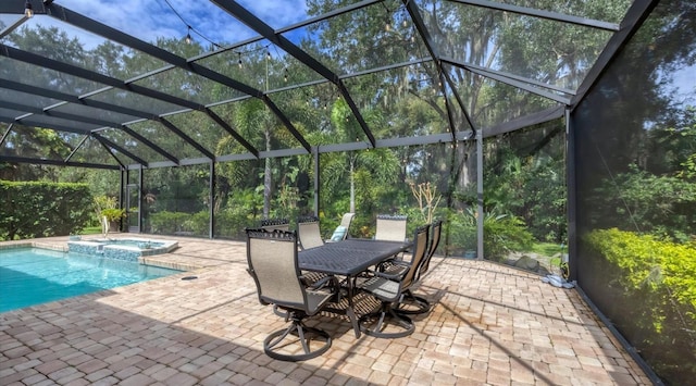 view of swimming pool with a lanai, an in ground hot tub, and a patio area