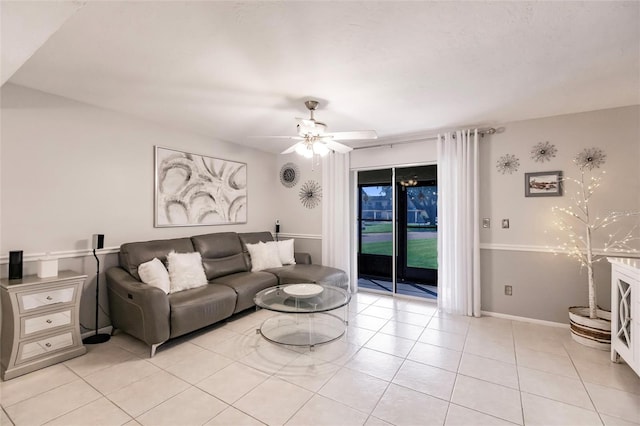 tiled living room with ceiling fan