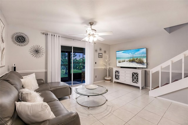 tiled living room with ceiling fan