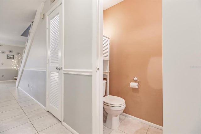 bathroom with tile patterned flooring and toilet