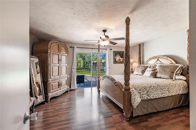 bedroom featuring ceiling fan, dark wood-type flooring, and access to outside