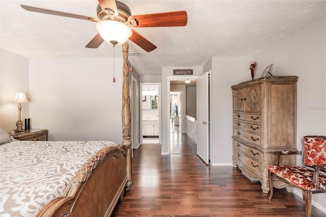 bedroom with ceiling fan, ensuite bath, and dark hardwood / wood-style floors