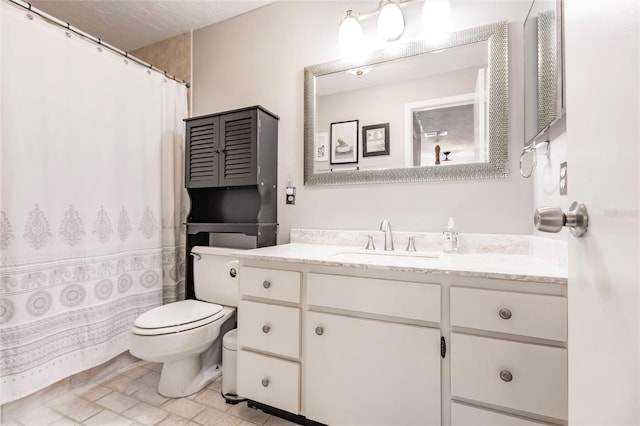 bathroom with vanity, toilet, and curtained shower