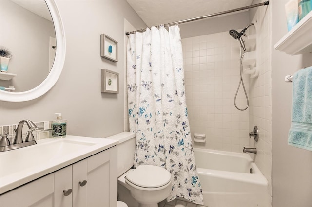 full bathroom featuring shower / bath combination with curtain, vanity, and toilet