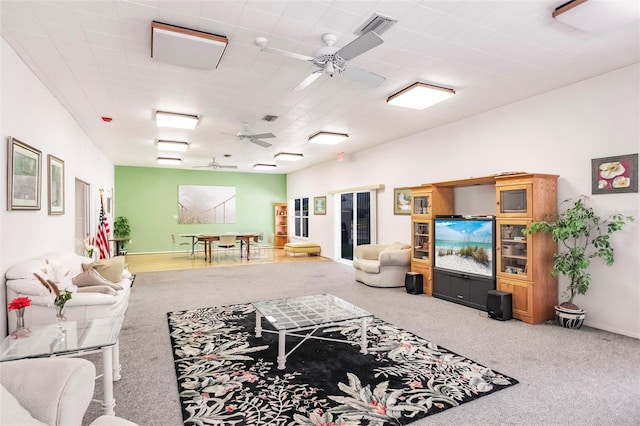 living room with carpet floors and ceiling fan