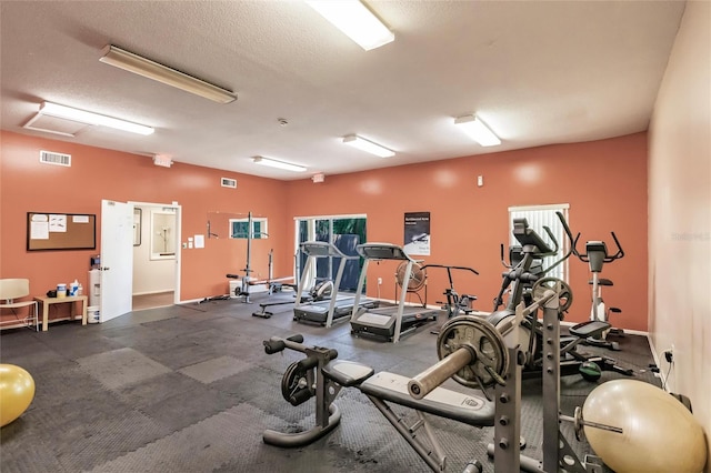 workout area with a textured ceiling