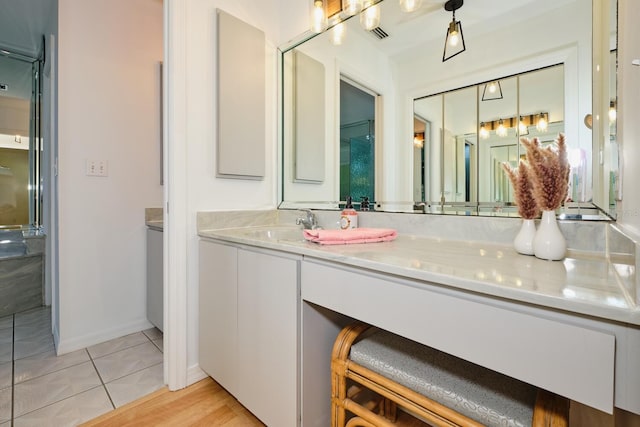 bathroom featuring wood-type flooring and vanity