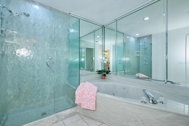 bathroom with separate shower and tub and tile patterned floors