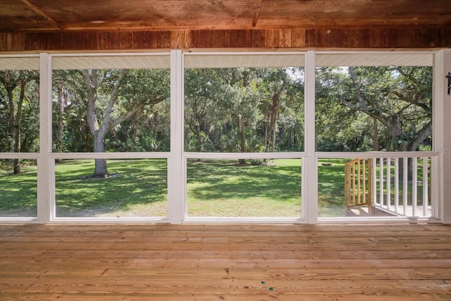 unfurnished sunroom featuring wood ceiling