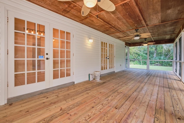 deck with french doors and ceiling fan