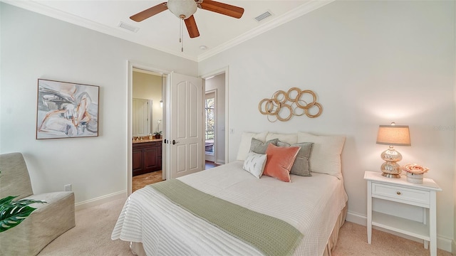 carpeted bedroom with ornamental molding, ensuite bathroom, and ceiling fan