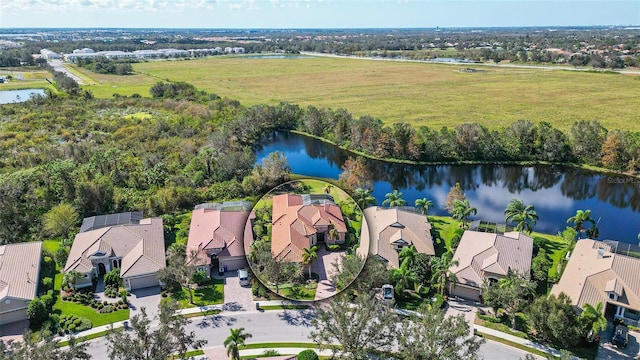 bird's eye view with a water view and a residential view