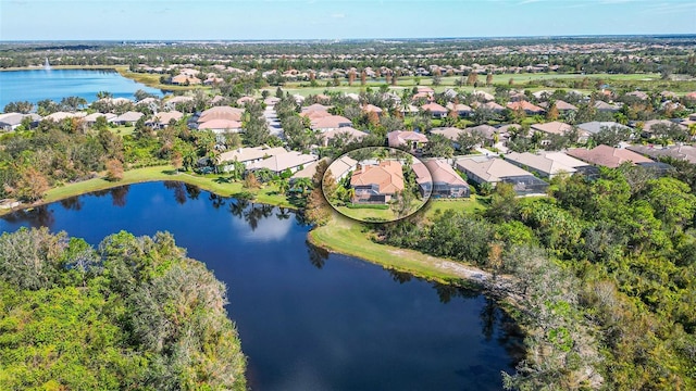 birds eye view of property featuring a residential view and a water view
