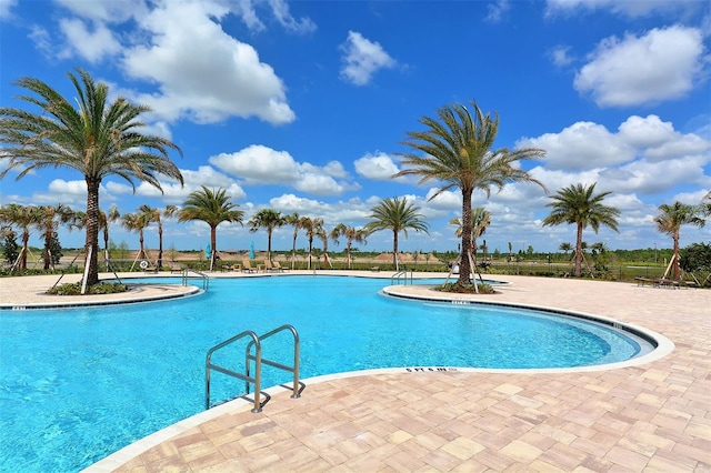 community pool featuring a patio area