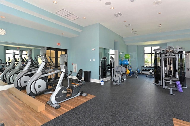 gym with recessed lighting, visible vents, and french doors