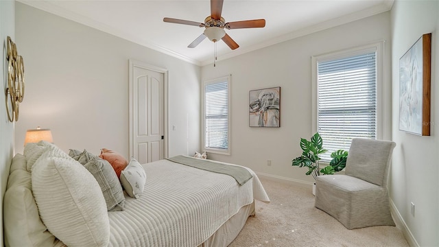 bedroom with crown molding, baseboards, ceiling fan, and light carpet