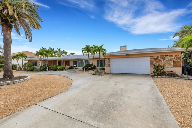 ranch-style home featuring a garage