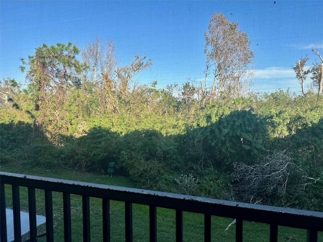 view of yard with a balcony