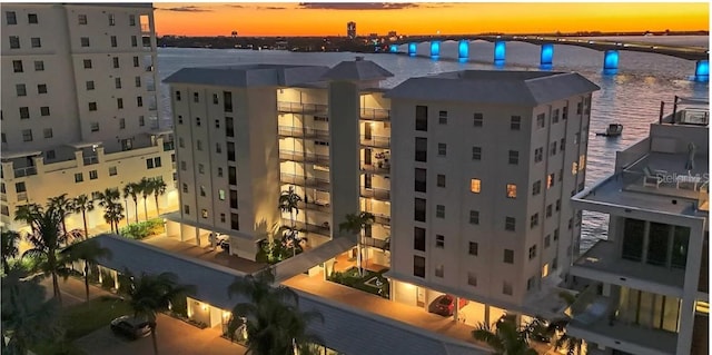 outdoor building at dusk featuring a water view