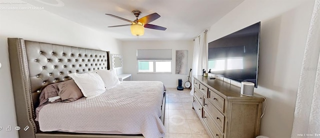 tiled bedroom featuring ceiling fan