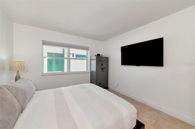 226 Golden Gate Pt Unit 64, Sarasota, FL 34236 - bedroom featuring baseboards