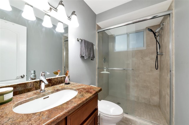 226 Golden Gate Pt Unit 64, Sarasota, FL 34236 - bathroom with vanity, a shower stall, and toilet