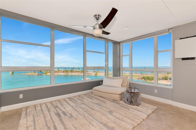 226 Golden Gate Pt Unit 64, Sarasota, FL 34236 - sunroom / solarium featuring plenty of natural light, baseboards, and a water view