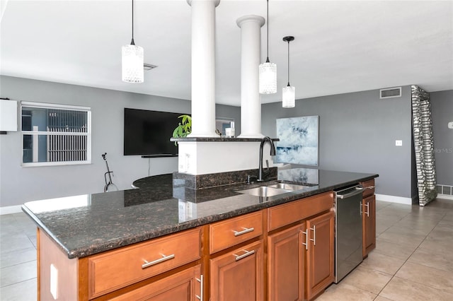 226 Golden Gate Pt Unit 64, Sarasota, FL 34236 - kitchen featuring stainless steel dishwasher, a sink, brown cabinets, visible vents, and ornate columns